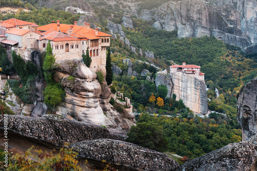 Monastery of Varlaam and Saint Barbara Rousanos building on top of a sandstone rock. Miracle of Meteora - harmony of men and nature in Greece. Must-visit iconic travel and pilgrimage destination