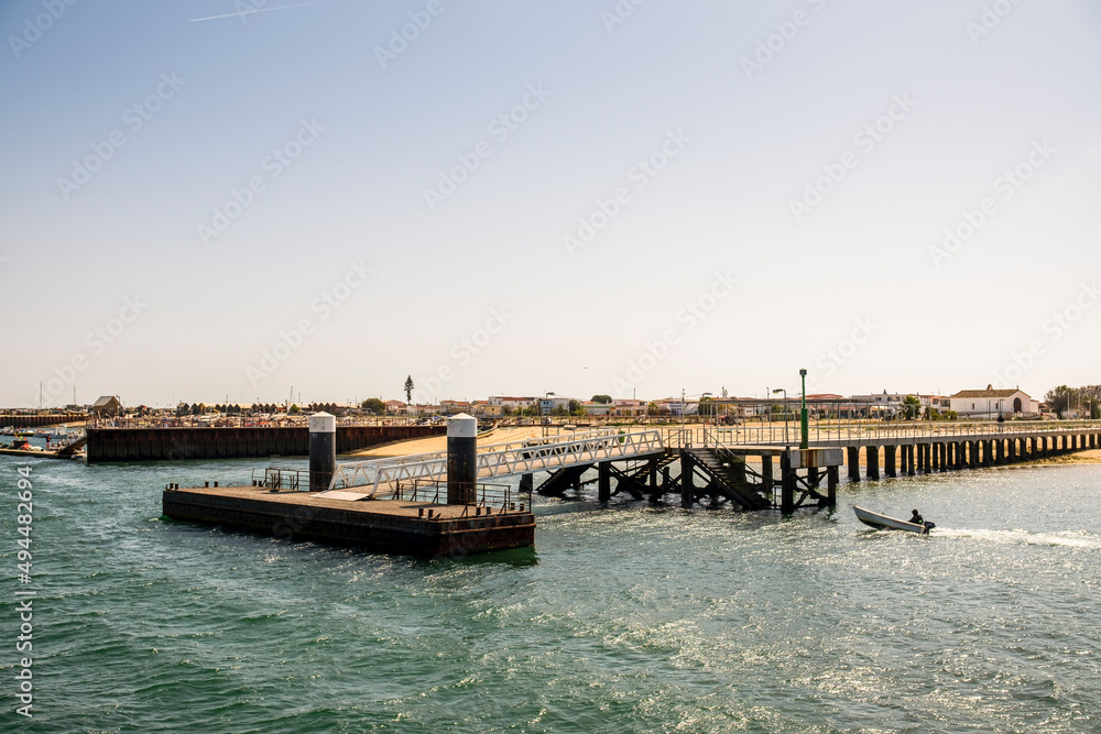 Pier and beach on Culatra Island, Faro, Algarve, Portugal Pier and beach on Culatra Island, Faro, Algarve, Portugal