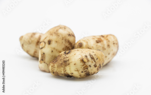 fresh taro root or Arbi on white background, it's have full on calcium and iron.