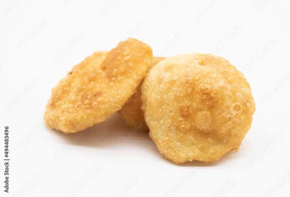 Puffed fried puri isolated on a white background