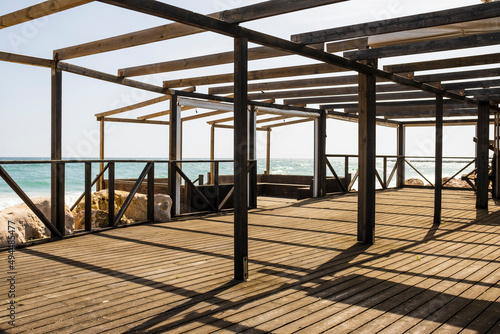 Wall Mural Wooden beachfront terrace at sunny day, Algarve, Portugal
