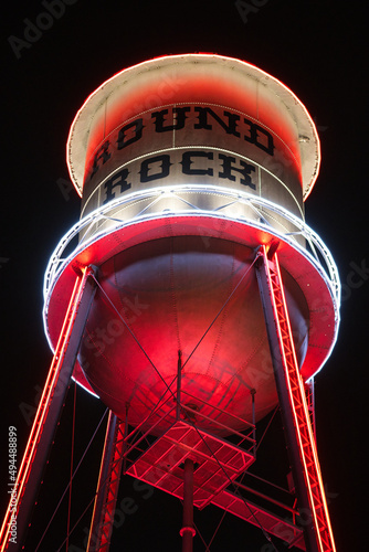 Low-angle shot of a water tower isolated on a black background in Round Rock, Texas, United States photo