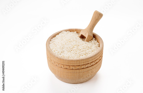 Long polished rice in bowls and bags isolated on a white background. High quality photo