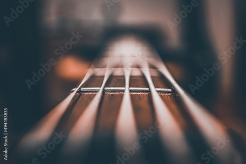 Closeup shot of a bass guitar strings against a blurred background