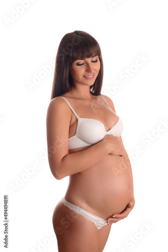 Pregnant woman dreaming about child. Young happy mother expectant thinking about her baby