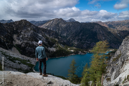 Aerial view of a hiker watching the view from the mountains near Colchuck Lake