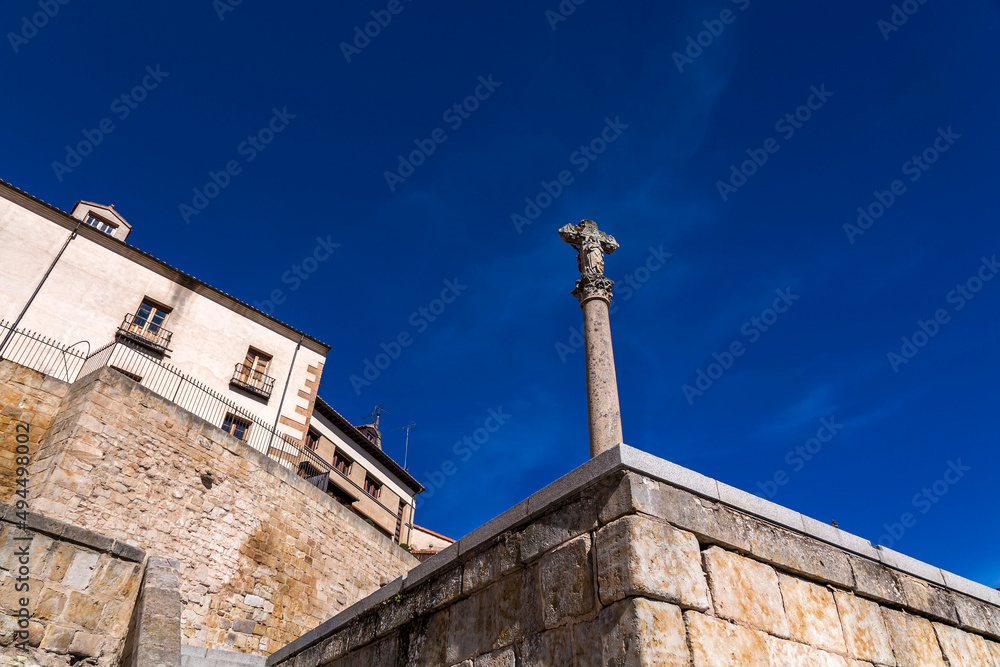 Jesus Christ on cross stone monument in Salamanca, Spain