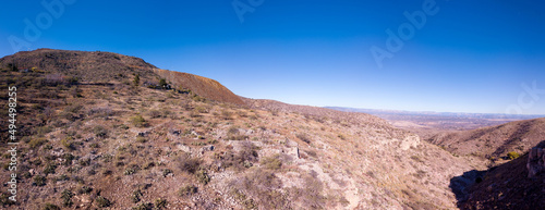 High rocky mountains with trees around Jerome city abbandoned mine ruins, Arizona, USA photo