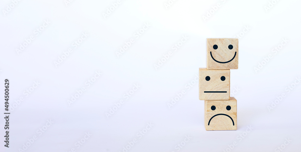 Obraz premium wooden cube stacked with emotion face icon on a white background rating increase rating excellent service Business Service Assessment customer experience Satisfaction Survey Concept
