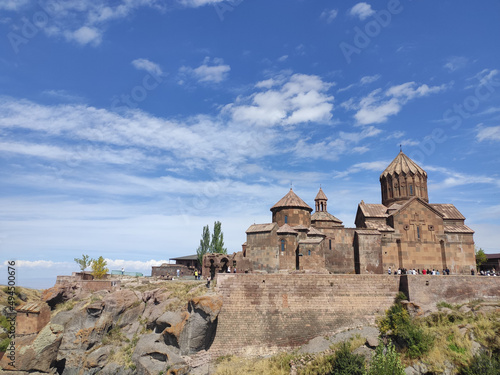 Horizontal shot of the Harichavank monastery with a background of a blue cloudy sky photo