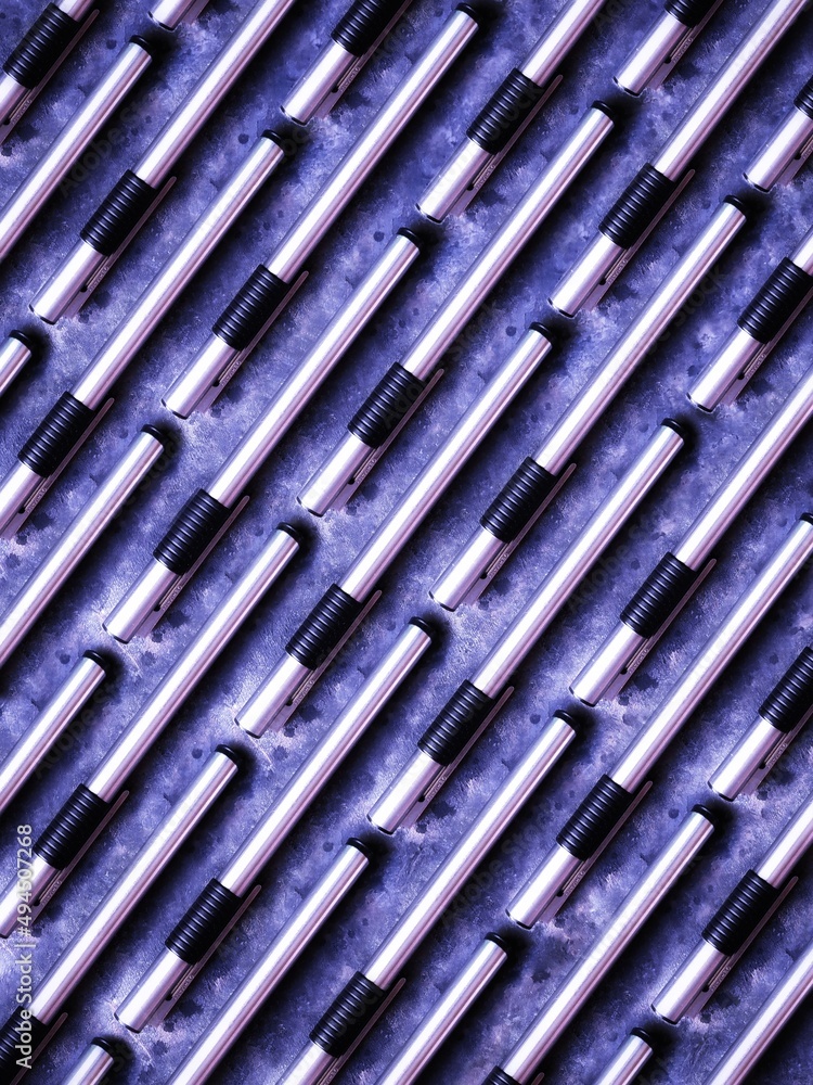 Very peri fountain pens background. Fountain pens pattern on black background Very peri fountain pens background. Fountain pens pattern on black background