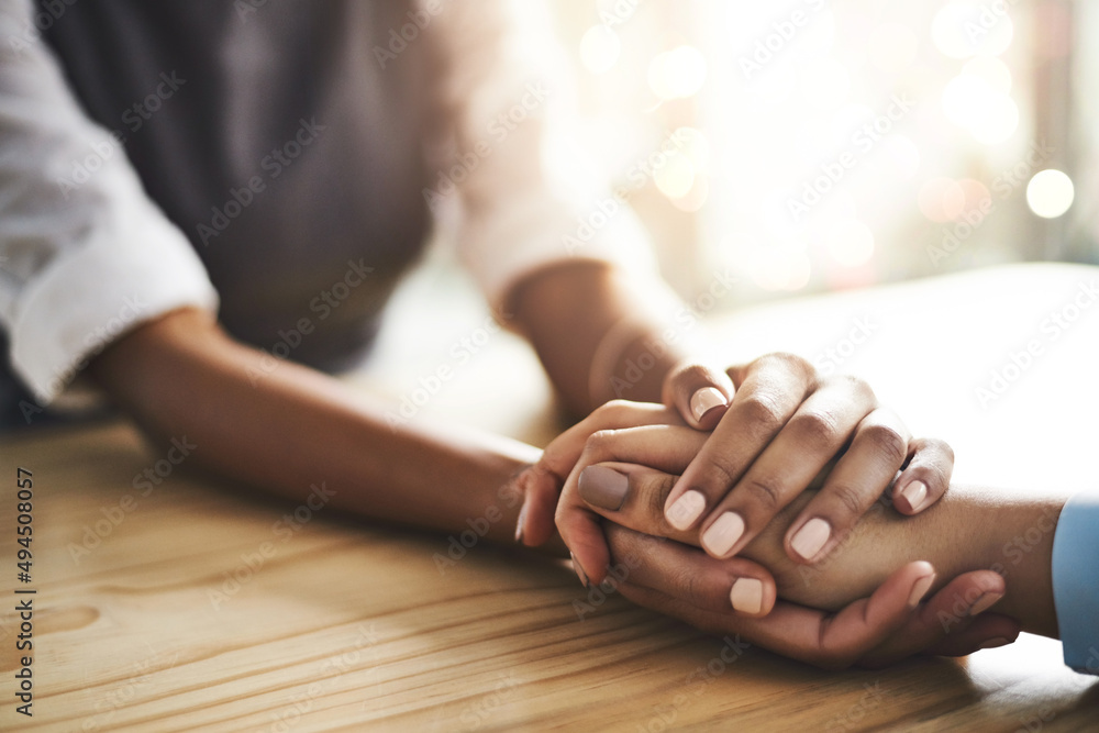 Lend a helping hand whenever you can. Closeup shot of two people holding hands in comfort.