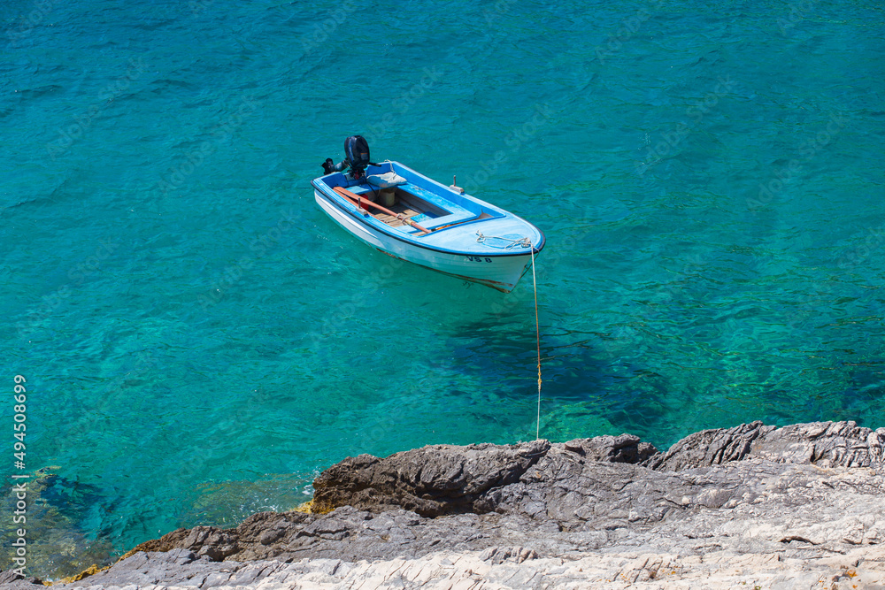 Boat tied to coast, Vis island, Croatia