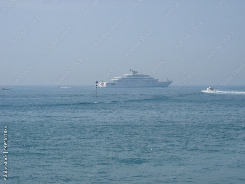 Views from the beach of Benalmadena with yacht in the background, Costa del Sol, Malaga, Andalusia, Spain