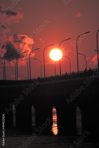 Vertical shot of the Sinamale Bridge during sunset in Maldives photo