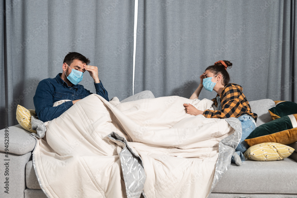 Sick man and woman have common cold, flu and high fever. Ill young ...