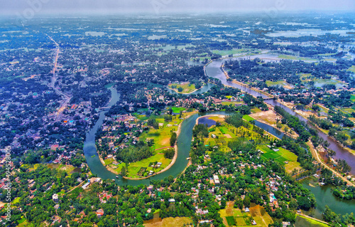 Aerial view of the flowing Karnaphuli River surrounded by greens in Bangladesh photo