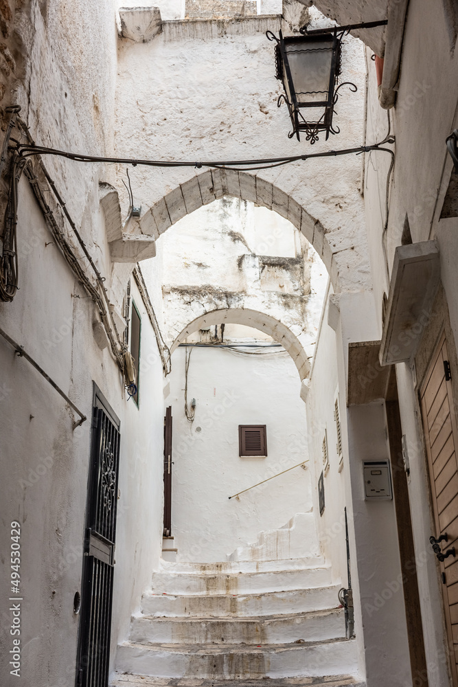 Beautiful and cozy white streets in the town historic center of Ostuni, Apulia Italy