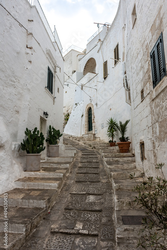 Beautiful and cozy white streets in the town historic center of Ostuni, Apulia Italy