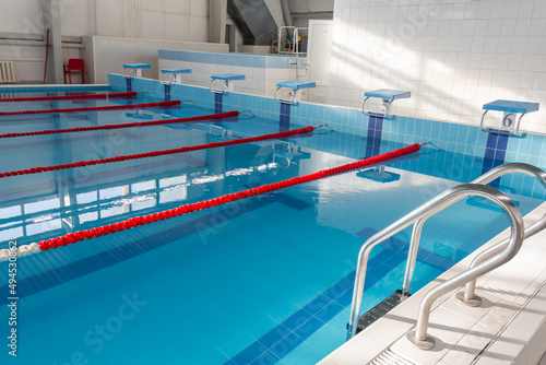 Swimming pool with clean water in the sports complex for athletes young and old. © ALA