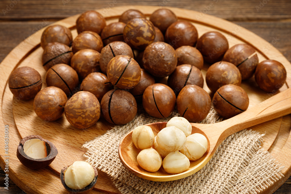 Macadamia nuts on a wooden table. Macadamia nuts on a wooden table.