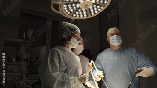 Team surgeon at work in operating room. Modern equipment in operating room. Medical devices for neurosurgery