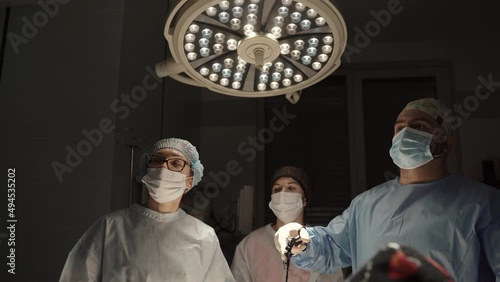 Team surgeon at work in operating room. Modern equipment in operating room. Medical devices for neurosurgery