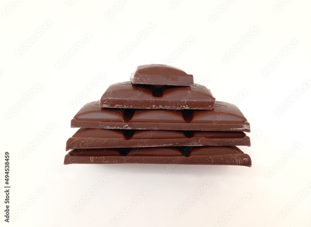 Dark chocolate bar texture isolated on white background from back view. Milk chocolate photo Dark chocolate bar texture isolated on white background from back view. Milk chocolate photo