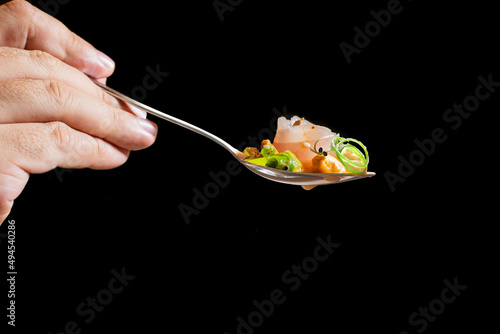 Corvina ceviche spoon with accompaniment photo