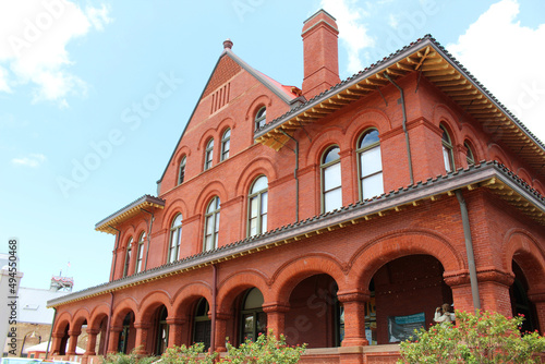 Low angle shot of a red building under a blue sky in Key West Florida, United States photo