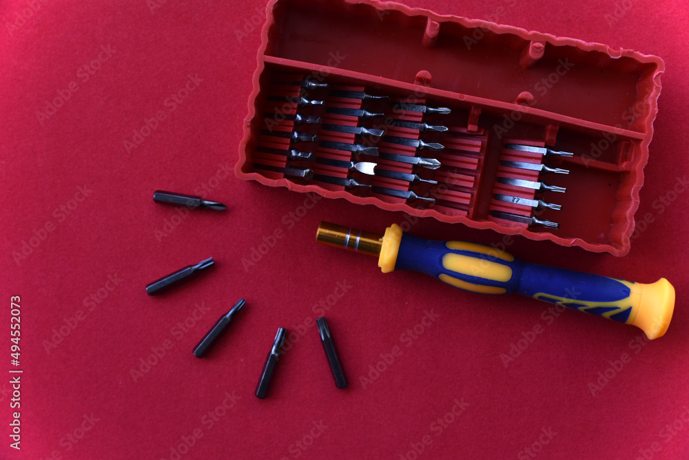 Yellow screwdriver with replaceable heads Yellow screwdriver with replaceable heads