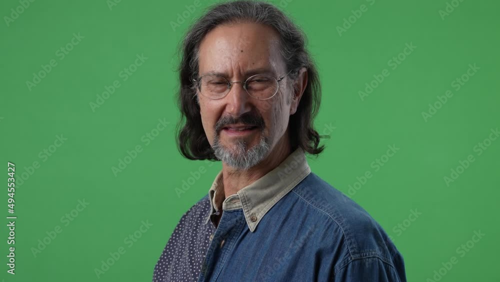 Portrait of mature man smiling happy face on green screen chroma key background in business shirt. Portrait of mature man smiling happy face on green screen chroma key background in business shirt.