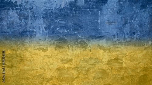Blue and yellow stone wall resembling Ukrainian flag. Copy space.