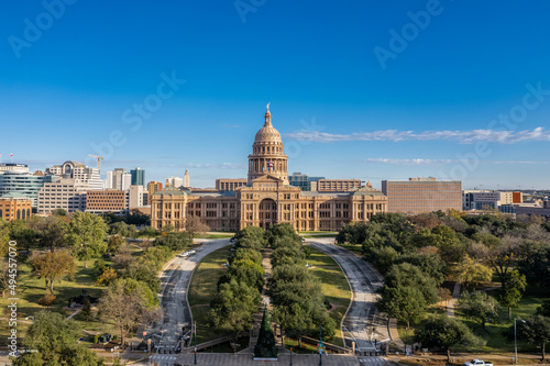 Texas State Capitol against a blue cloudy sky on a sunny day photo