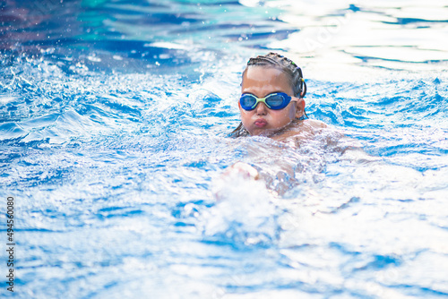 Portrait of a little swimer at the pool