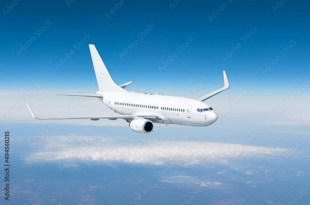 Airplane flying away in to sky high altitude above the earth.