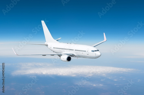 Airplane flying away in to sky high altitude above the earth.