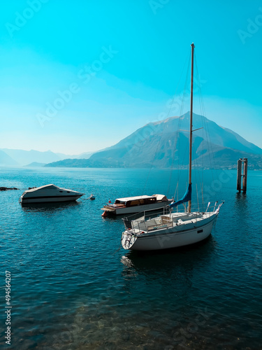Blue Lake Como on the background of mountains and boats
