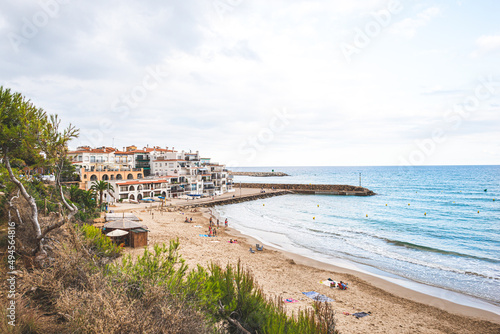 Beautiful white houses  mediterranean sea and a clear blue sky in the setting sun and sunset in El Roc de Sant Gaieta  Catalonia