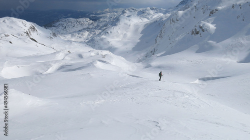 A man skis through the endless beautiful snowy landscape of the Julian Alps. Slovenia, Triglav national park
