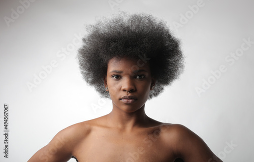 portrait of young black woman on gray background