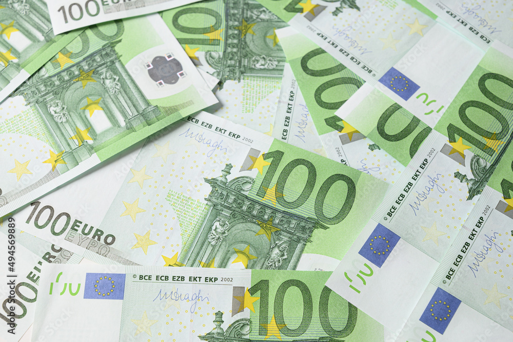 European money in banknotes of 100 euros. Economic collapse. View from above. European money in banknotes of 100 euros. Economic collapse. View from above.