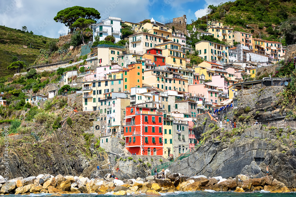  Riomaggiore on the sunny day in summer. View from sea. Italy