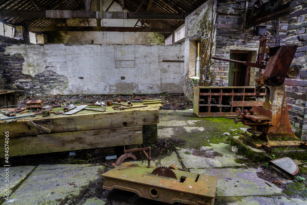 Derelict workshop with abandoned equipment.