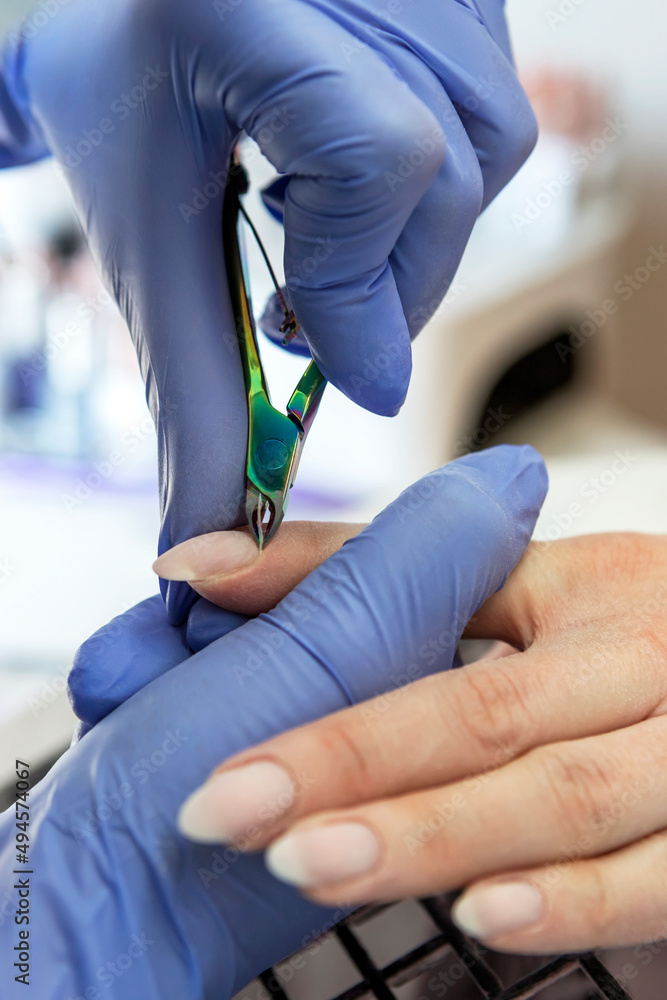Beautician makes a manicure
