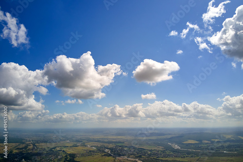 Photography Aerial view from high altitude of earth covered with white puffy cumulus clouds