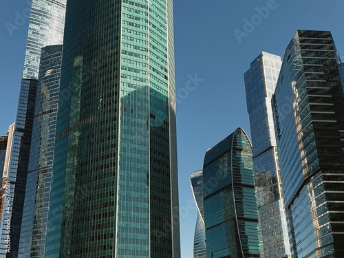 Tall modern office blue buildings in Moscow City. Moscow-City skyscrapers, Russia. Tops of modern corporate buildings and blue sky.