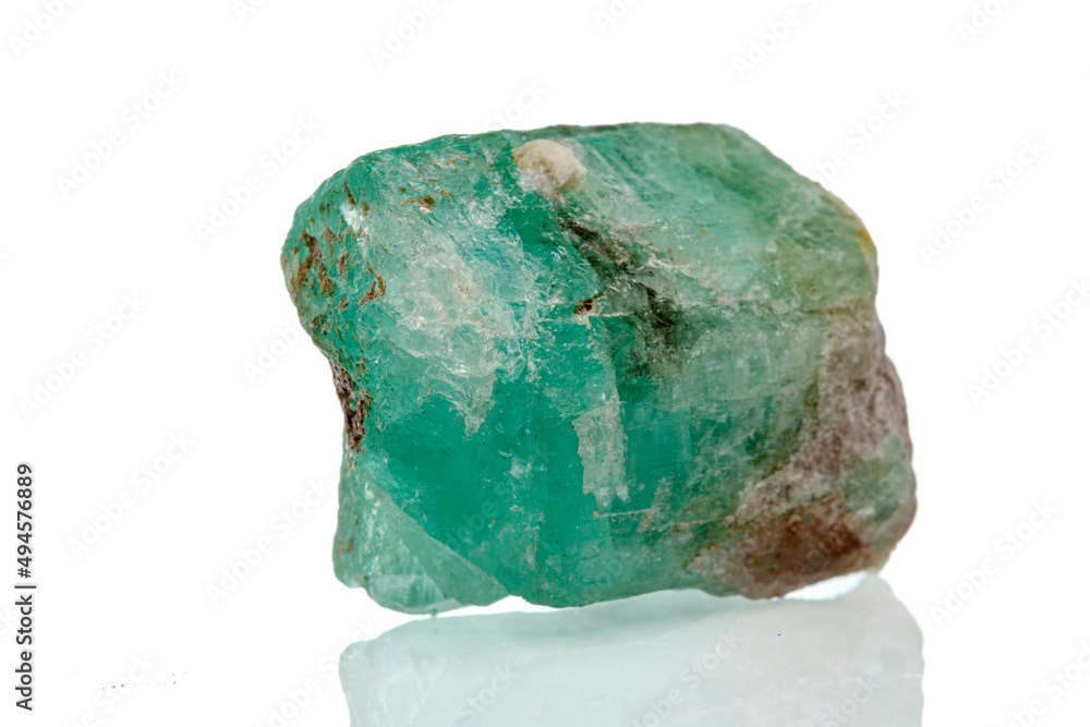 macro mineral stone emerald on a white background macro mineral stone emerald on a white background