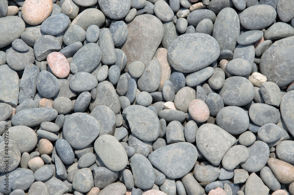 background of grey stones on the beach, large and small, pattern background of grey stones on the beach, large and small, pattern