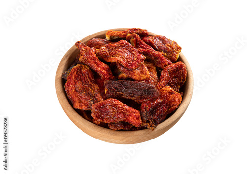 Bowl of dried tomatoes on white background, directly above